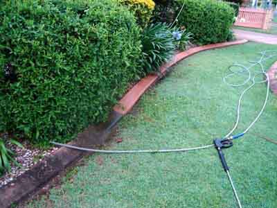 Cleaning removes mould on concrete garden edges